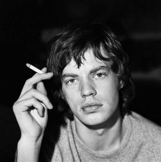 Mick Jagger portrait holding a cigarette in 1965