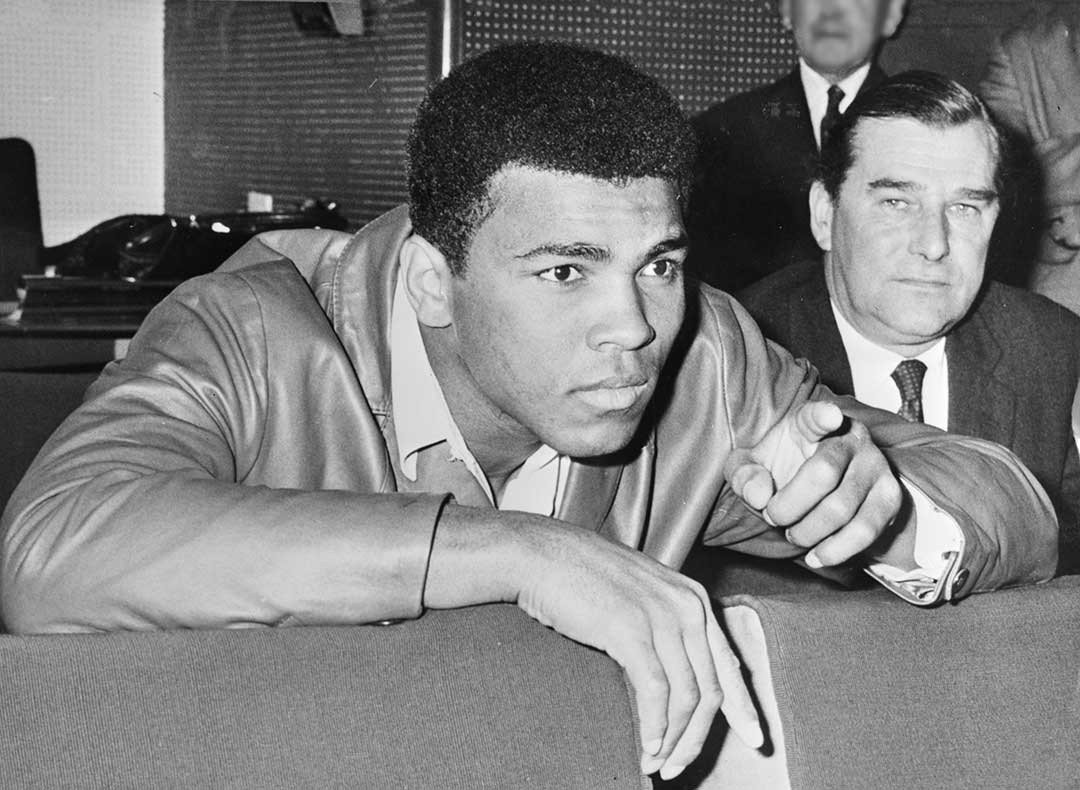 Muhammad Ali watches replay of his 1966 title fight against Henry Cooper