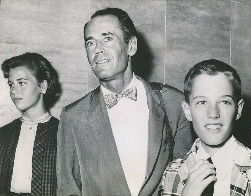 Jane Fonda (left) with her father Henry Fonda (middle) and younger brother Peter Fonda (right) in the 50s