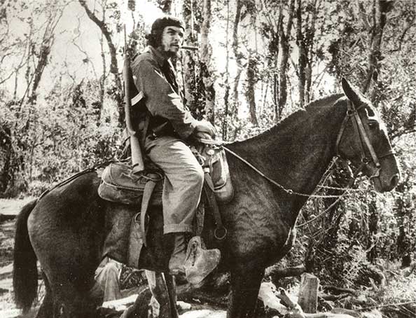 Che Guevara on a mule in Las Villas, Cuba (1958)