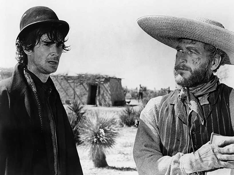 Anthony Perkins (left) with Paul Newman (right) in the film "The Life and Times of Judge Roy Bean" (1972)