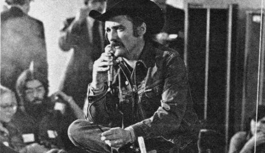 Portrait of Dennis Hopper giving a speech (1973)