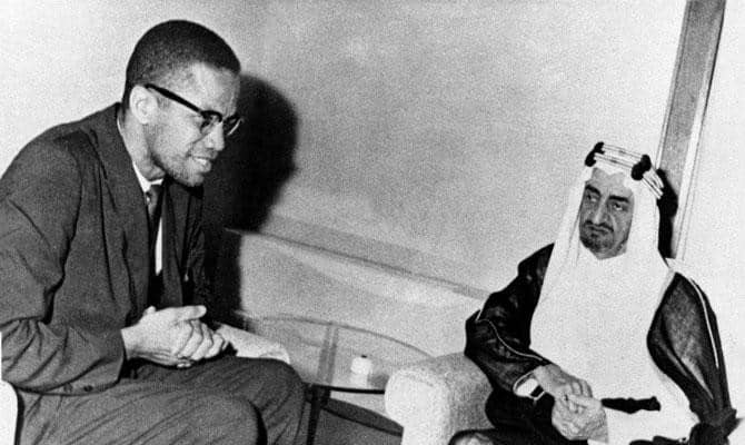 Malcolm X (lef) meeting with then Crown Prince Faisal Al-Saud (right) in Jeddah, April 1964