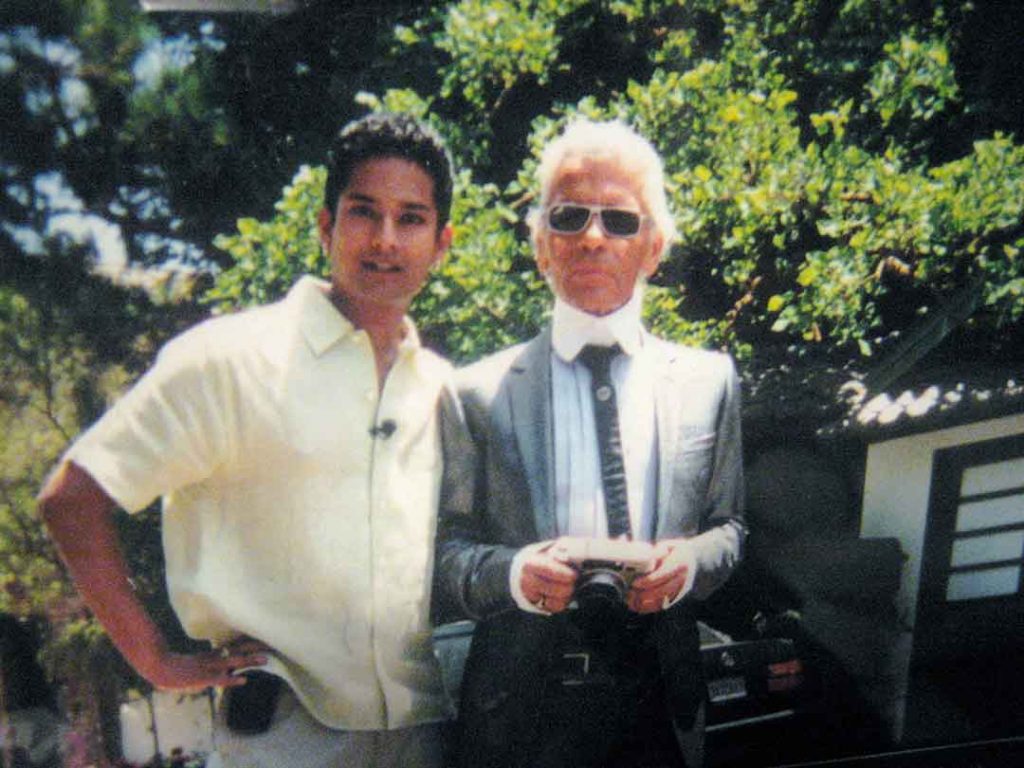 TB host Darrin Maharaj (left) and fashion designer Karl Lagerfeld (right) at Pamela Anderson's residence in Malibu, California (2002)