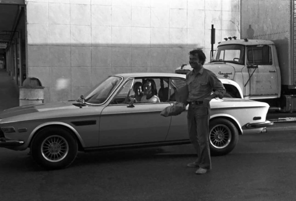 Peter Fonda driving a car in Key West during the filming of "92 in the Shade" (1974)