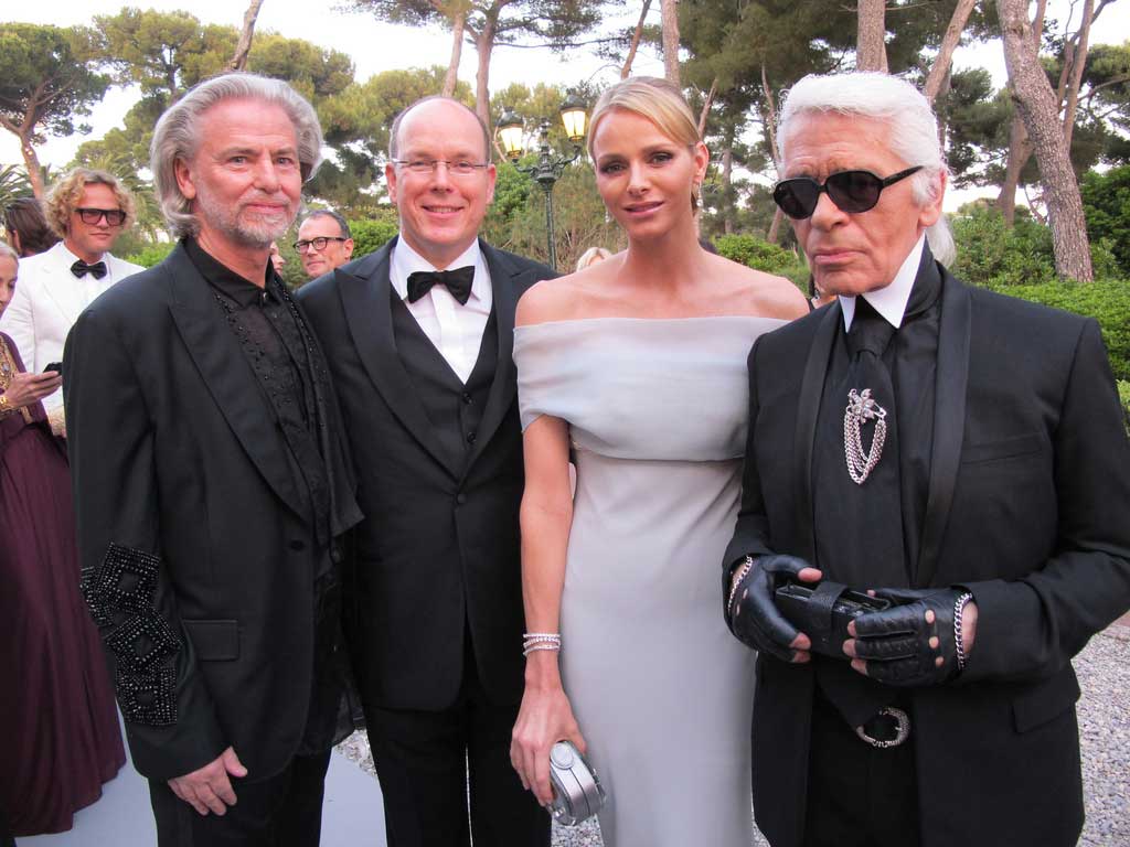 The Prince and Princess of Monaco (centre) with Hermann Bühlbecker (left) and Karl Lagerfeld (right) at the "Cinema Against AIDS" Gala (2011)