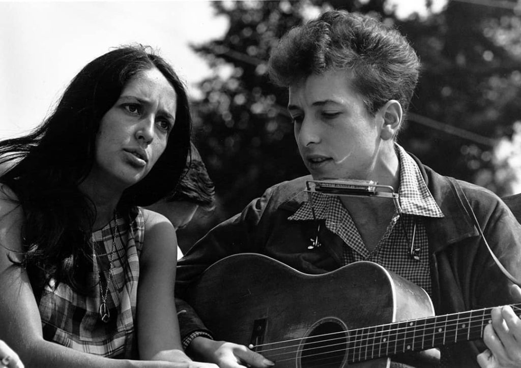 Joan Baez (left) with Bob Dylan (right) during the Civil Rights March on Washington, D.C. USA (1963)