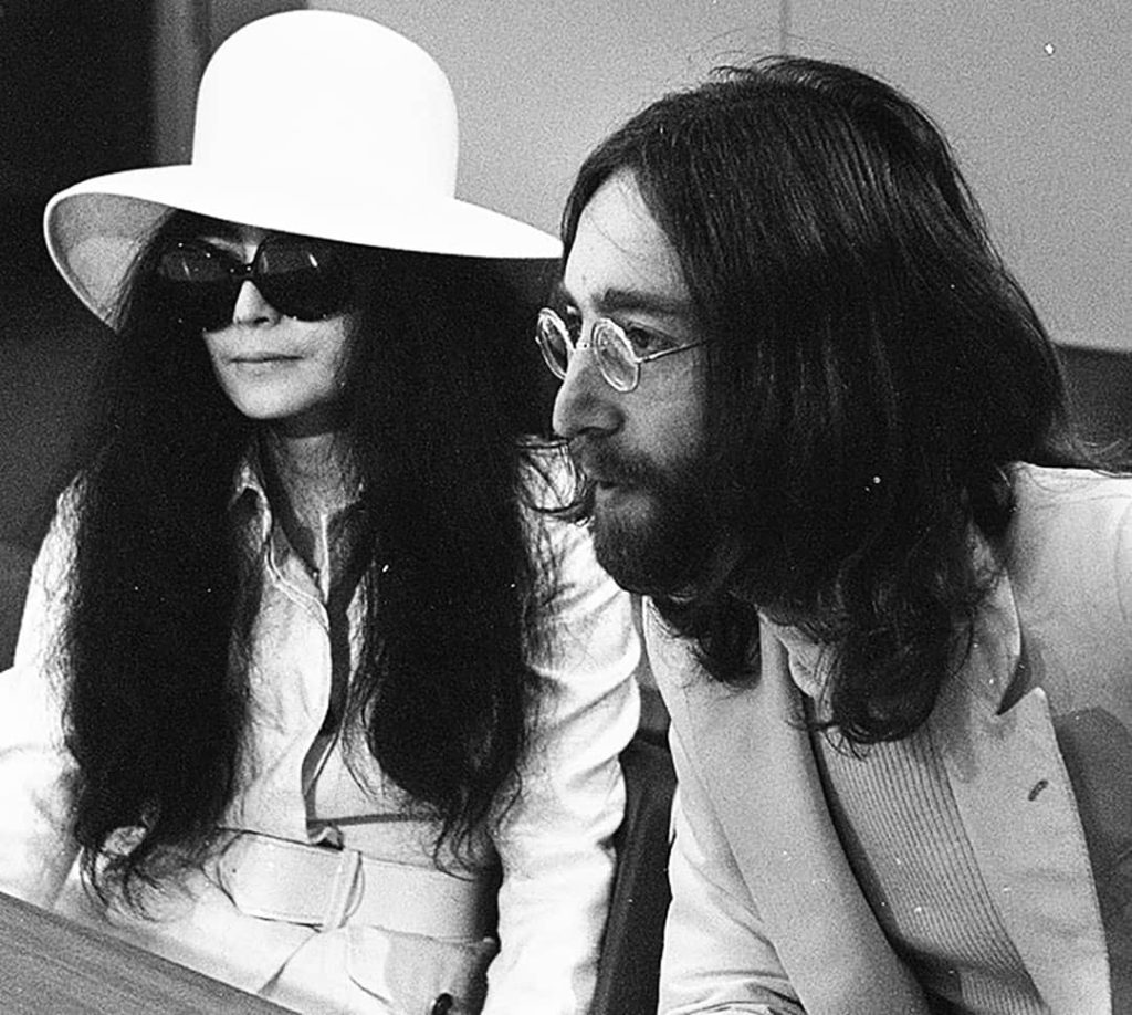 John Lennon (right) and Yoko Ono (left) in the departure hall of the Schiphol airport (1969) [Different angle]