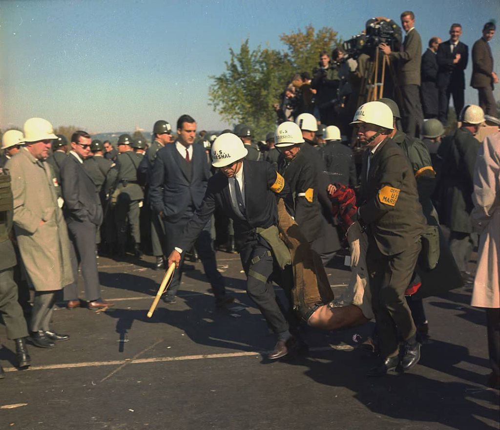 U.S. Marshals removing one of the protesters during the outbreak of violence at the Pentagon building during the Vietnam War Protests, Arlington County, Virginia, USA (1967)