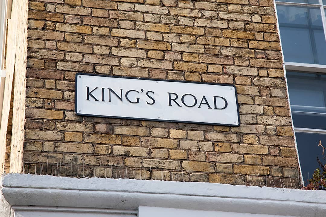 King's Road street sign on a brick wall