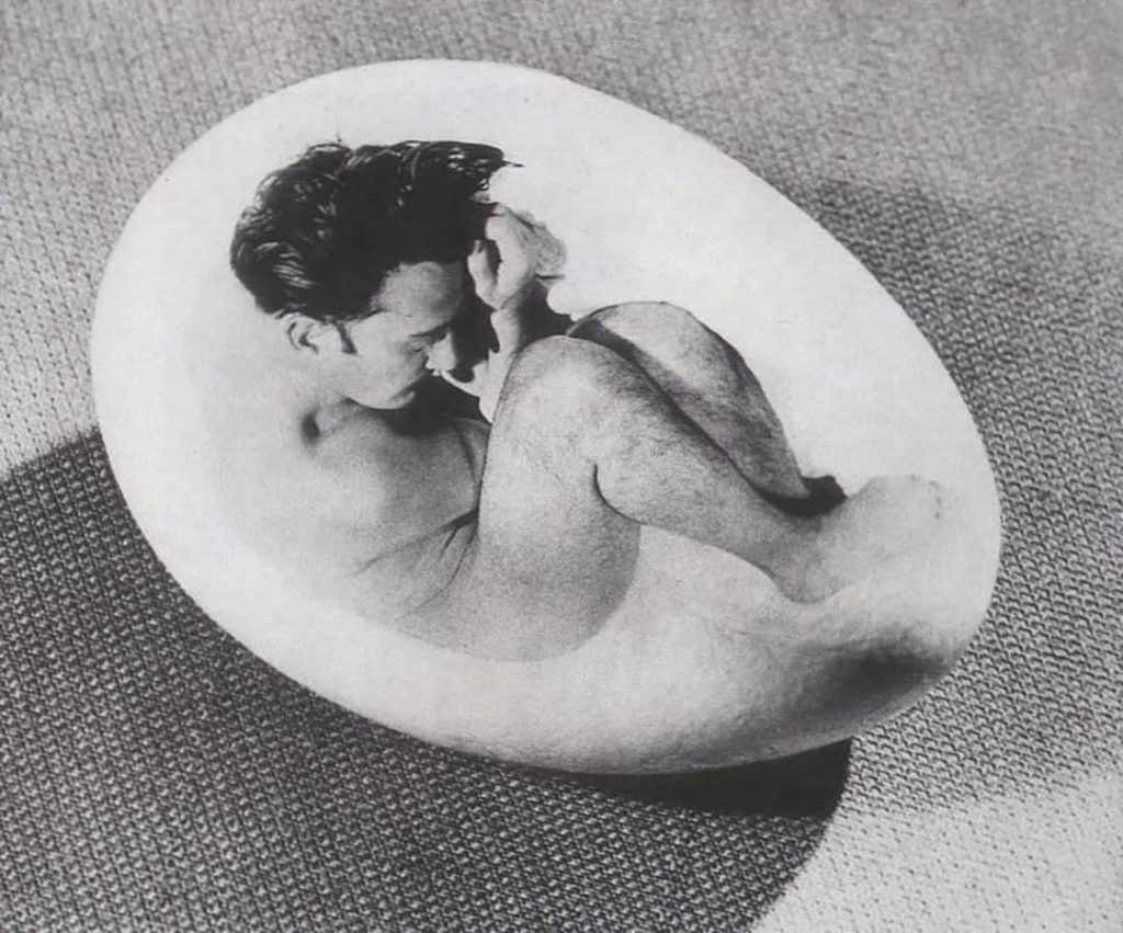Salvador Dalí posing as an embryo for Philippe Halsman’s work (1941)