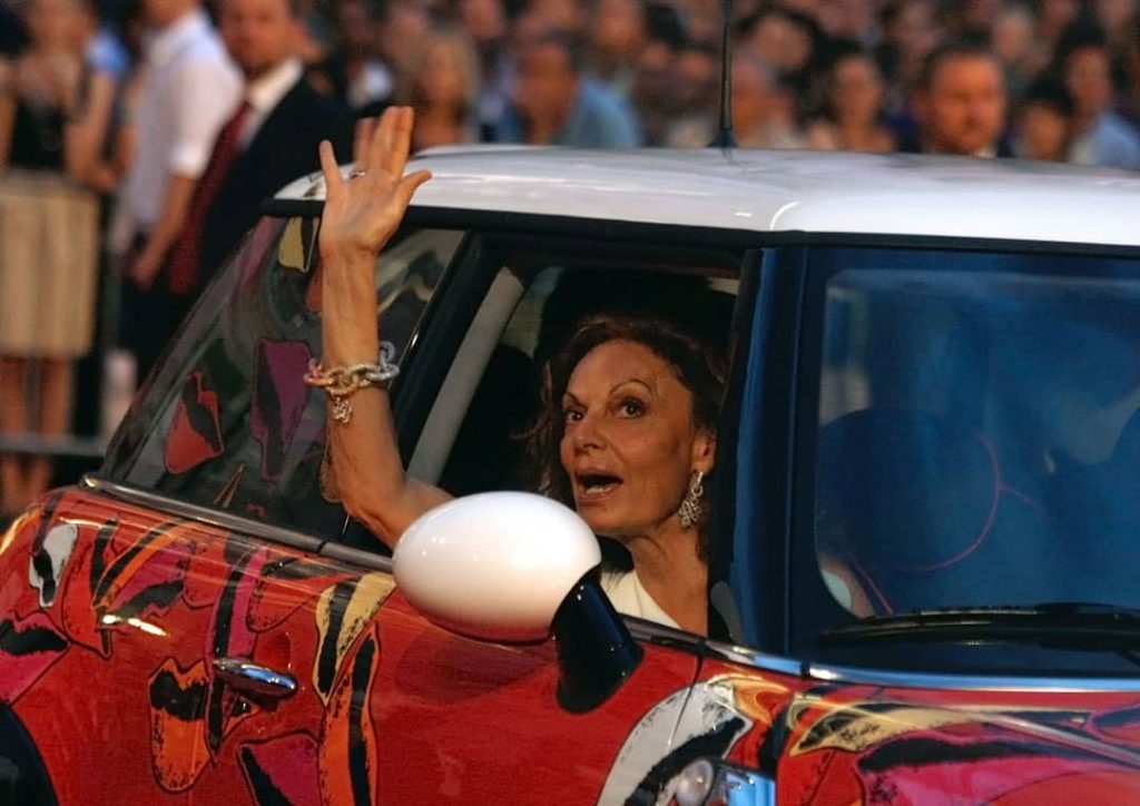 Diane von Fürstenberg inside a red car on the red carpet of the Life Ball (2010)