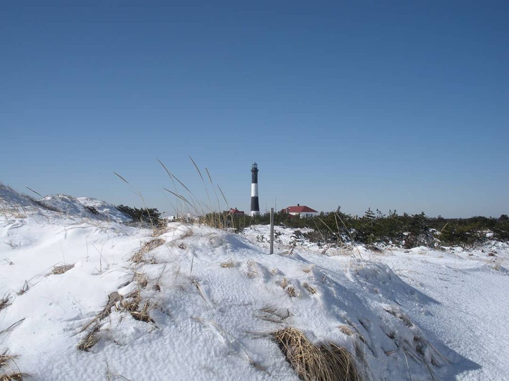 The snow covered beaches of Robert Moses State Park with Fire Island Lighthouse in the background, Long Island, New York (2010)