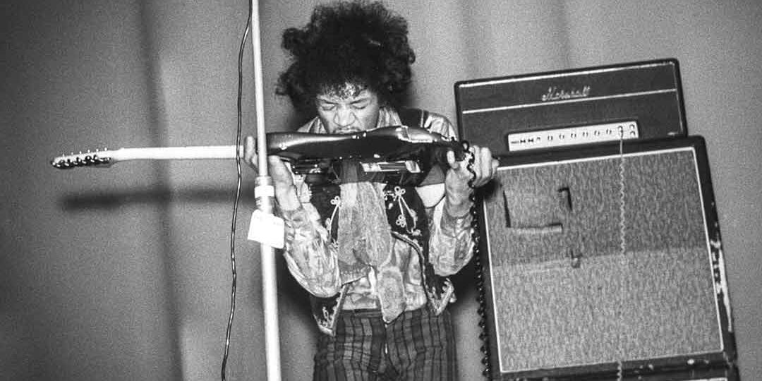 Jimi Hendrix playing the guitar with his teeth at the Culture House in Helsinki