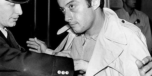 Newspaper press photo of Lenny Bruce bring arrested in 1961