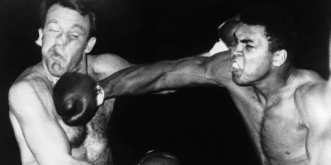Muhammad Ali fighting Brian London landing a punch (1966)