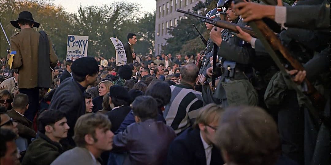 Members of the military police keep back protesters during the sit-in protest at the Mall Entrance to the Pentagon (1967)