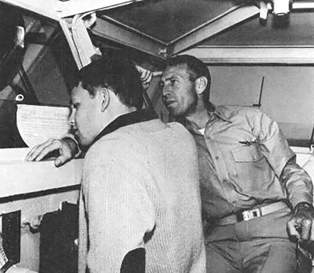 Jim Morrison (left) and his father George Stephen Morrison (right) on the bridge of the USS Bon Homme Richard (1964)
