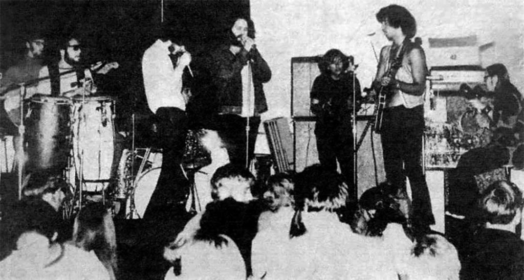 Eric Burdon (left) and Jim Morrison (centre left) performing with the band Blues Image onstage at the Whisky a Go Go club in West Hollywood, California, USA (1969)